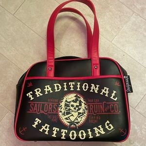 Purse only used once. Just like new “traditional tattoo” rockabilly style.